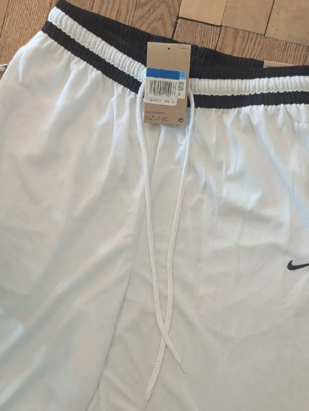 Nike Men’s White Athletic Shorts with Black Trim and Swoosh